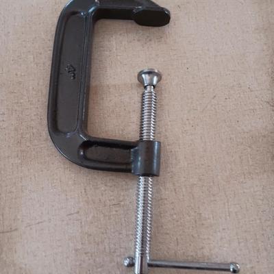 Four metal T handled clamps