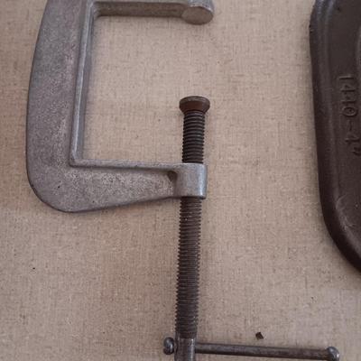 Four metal T handled clamps