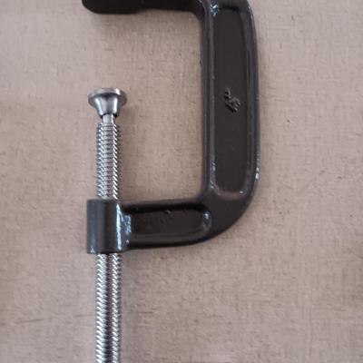 Four metal T handled clamps