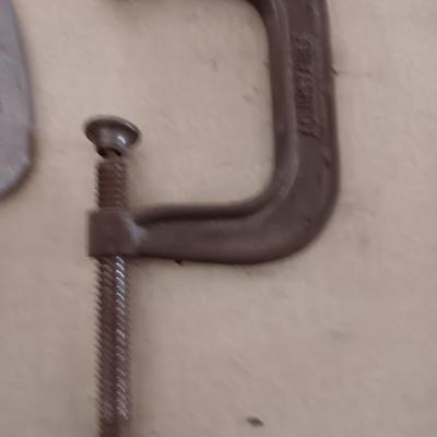 Four metal T handled clamps