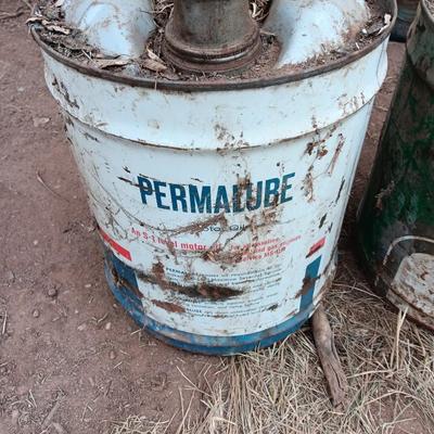 Two vintage Oil cans Permaube and Super Motor metal cans