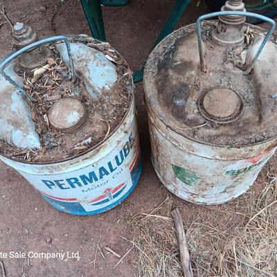 Two vintage Oil cans Permaube and Super Motor metal cans