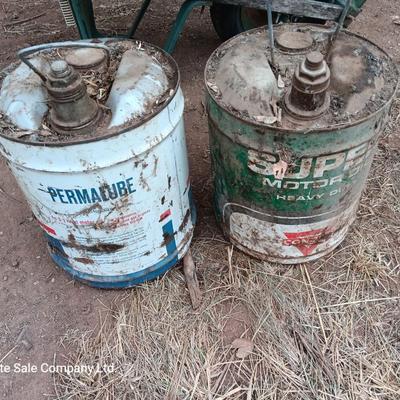 Two vintage Oil cans Permaube and Super Motor metal cans