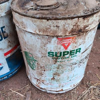 Two vintage Oil cans Permaube and Super Motor metal cans