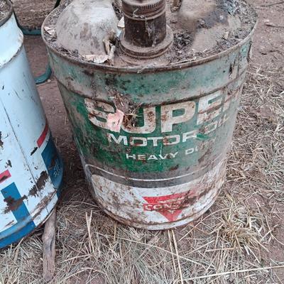 Two vintage Oil cans Permaube and Super Motor metal cans