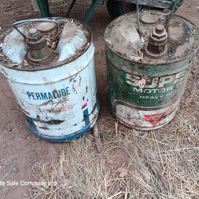 Two vintage Oil cans Permaube and Super Motor metal cans