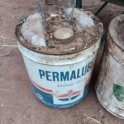 Two vintage Oil cans Permaube and Super Motor metal cans