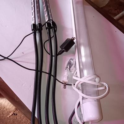 Vazillio LED adjustable arm grow light a with timer and an AFX model SLEU22GR Grow light. 1 of 2