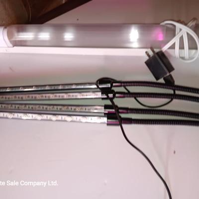 Vazillio LED adjustable arm grow light a with timer and an AFX model SLEU22GR Grow light. 1 of 2