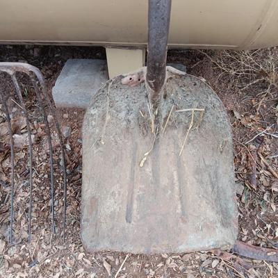 Vintage scoop shovel with antique pitch fork