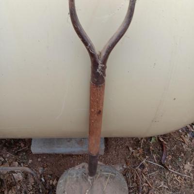 Vintage scoop shovel with antique pitch fork