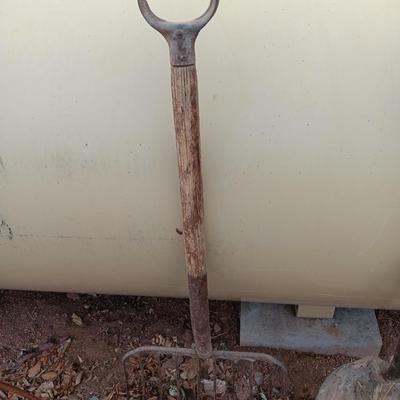 Vintage scoop shovel with antique pitch fork