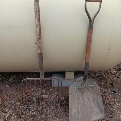 Vintage scoop shovel with antique pitch fork