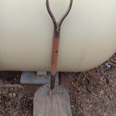 Vintage scoop shovel with antique pitch fork