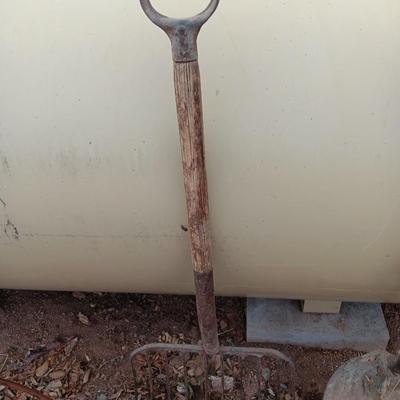 Vintage scoop shovel with antique pitch fork