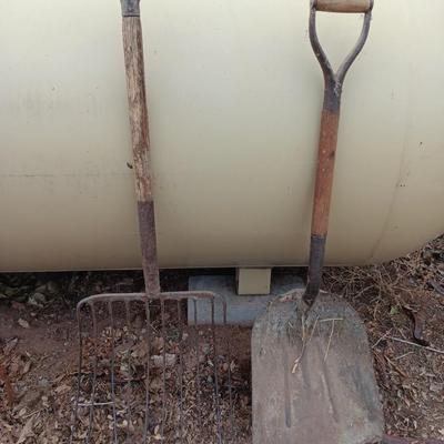 Vintage scoop shovel with antique pitch fork