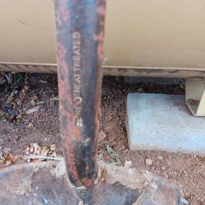 Two shovels and a vintage pickaxe