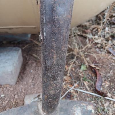Two shovels and a vintage pickaxe