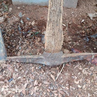 Two shovels and a vintage pickaxe