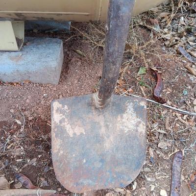 Two shovels and a vintage pickaxe
