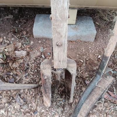 Vintage hand tools - post hole diggers = pickaxe and scythe