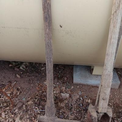 Vintage hand tools - post hole diggers = pickaxe and scythe