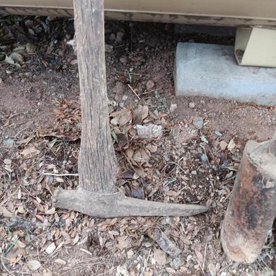 Vintage hand tools - post hole diggers = pickaxe and scythe