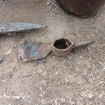 Wooden crate with Pickaxe heads and a rusty feed bucket