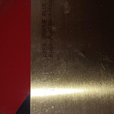 Box of colored Laser brass plated steel sheeting and pieces
