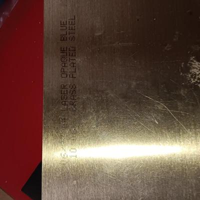 Box of colored Laser brass plated steel sheeting and pieces