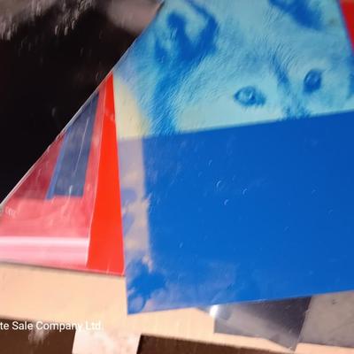 Box of colored Laser brass plated steel sheeting and pieces