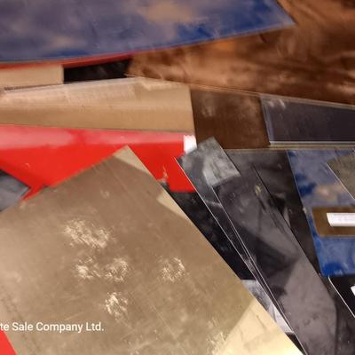 Box of colored Laser brass plated steel sheeting and pieces