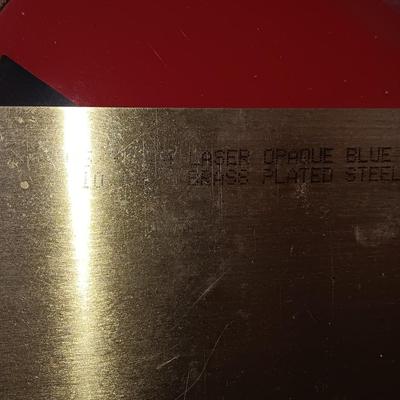 Box of colored Laser brass plated steel sheeting and pieces