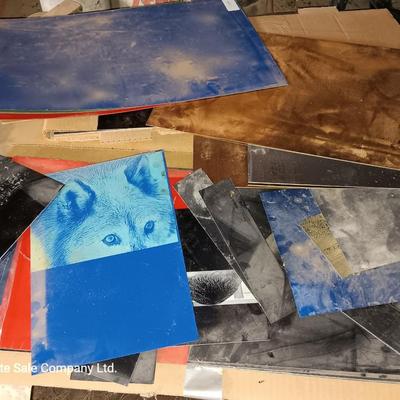 Box of colored Laser brass plated steel sheeting and pieces