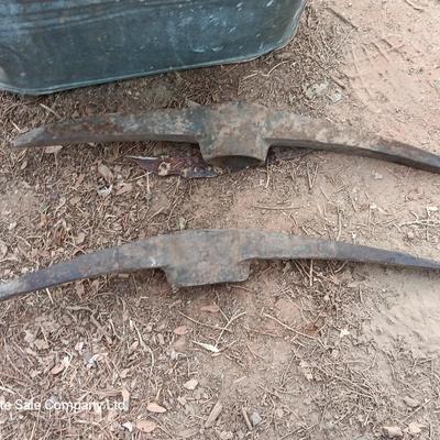 Metal wash tub with two vintage pickaxe heads