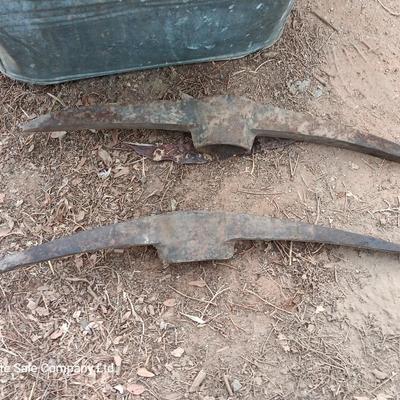Metal wash tub with two vintage pickaxe heads