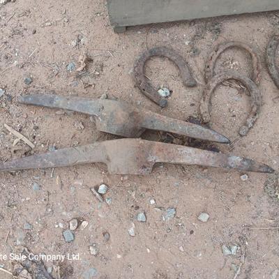 Wooden crate box with horseshoes and pickaxe heads