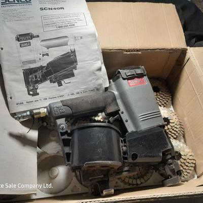 Senco Fastening systems SCN40R coil roofing Nailer with partial box of nails