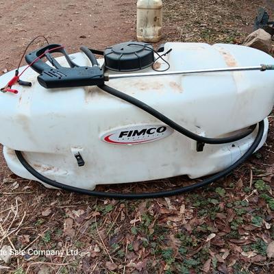 Working Fimco pesticide spray tank with high flo gold series pump and wand four-wheel mount