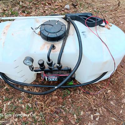 Working Fimco pesticide spray tank with high flo gold series pump and wand four-wheel mount