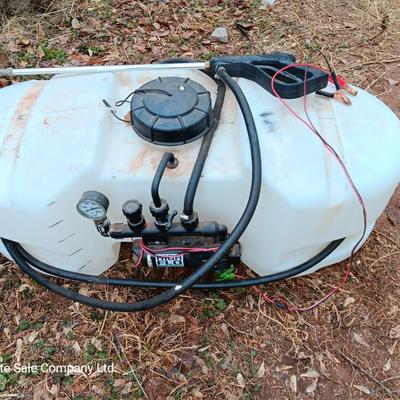 Working Fimco pesticide spray tank with high flo gold series pump and wand four-wheel mount