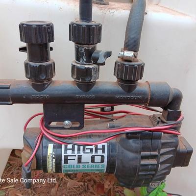 Working Fimco pesticide spray tank with high flo gold series pump and wand four-wheel mount