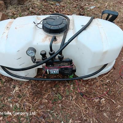 Working Fimco pesticide spray tank with high flo gold series pump and wand four-wheel mount