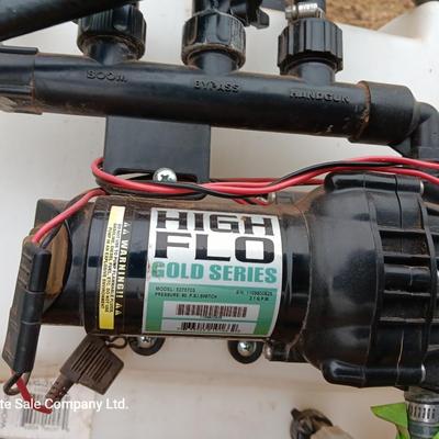 Working Fimco pesticide spray tank with high flo gold series pump and wand four-wheel mount