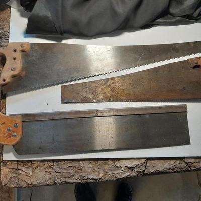 Three wooden handled handsaws