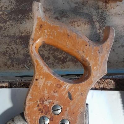 Three wooden handled handsaws