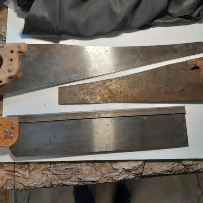 Three wooden handled handsaws