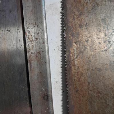 Three wooden handled handsaws
