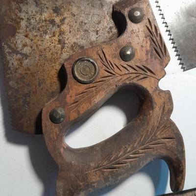 Three wooden handled handsaws