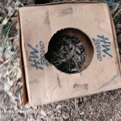 Partial roll of barbed wire and two partial boxes of HW Brand Bailing wire
